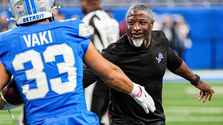 Detroit Lions defensive coordinator Aaron Glenn shakes hands with running back Sione Vaki (33) during warm up before the Tennessee Titans game at Ford Field in Detroit on Sunday, Oct. 27, 2024. Detroit Lions defensive coordinator Aaron Glenn shakes hands with running back Sione Vaki (33) during warm up before the Tennessee Titans game at Ford Field in Detroit on Sunday, Oct. 27, 2024.