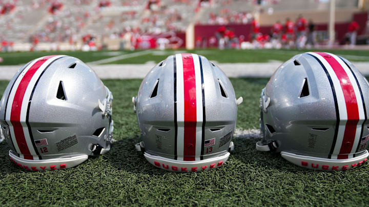 Sep 2, 2023; Bloomington, Indiana, USA; Ohio State Buckeyes helmets sit on the sideline prior to the NCAA football game at Indiana University Memorial Stadium.