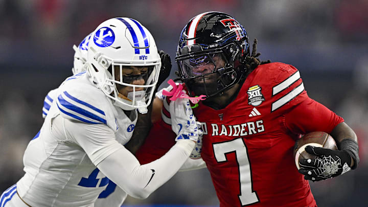 Dec 6, 2025; Arlington, TX, USA; Texas Tech Red Raiders tight end Terrance Carter Jr. (7) attempts to elude BYU Cougars safety Faletau Satuala (11) during the first half at AT&T Stadium. Mandatory Credit: Jerome Miron-Imagn Images Dec 6, 2025; Arlington, TX, USA; Texas Tech Red Raiders tight end Terrance Carter Jr. (7) attempts to elude BYU Cougars safety Faletau Satuala (11) during the first half at AT&T Stadium. Mandatory Credit: Jerome Miron-Imagn Images