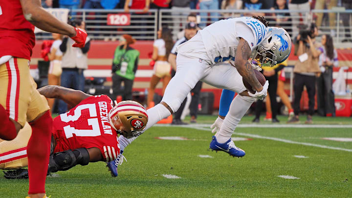 Jan 28, 2024; Santa Clara, California, USA; Detroit Lions wide receiver Jameson Williams (9) runs with the ball for a touchdown San Francisco 49ers linebacker Dre Greenlaw (57) during the first half of the NFC Championship football game at Levi's Stadium. Mandatory Credit: Kelley L Cox-Imagn Images