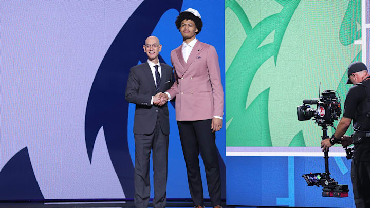 Jun 25, 2025; Brooklyn, NY, USA; Joan Beringer stands with NBA commissioner Adam Silver after being selected as the 17th pick by the Minnesota Timberwolves in the first round of the 2025 NBA Draft at Barclays Center. Mandatory Credit: Brad Penner-Imagn Images Jun 25, 2025; Brooklyn, NY, USA; Joan Beringer stands with NBA commissioner Adam Silver after being selected as the 17th pick by the Minnesota Timberwolves in the first round of the 2025 NBA Draft at Barclays Center. Mandatory Credit: Brad Penner-Imagn Images