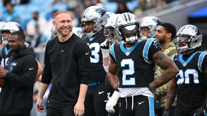 Nov 21, 2021; Charlotte, North Carolina, USA; Carolina Panthers assistant coach Joe Brady and wide receiver D.J. Moore (2) on the field before the game at Bank of America Stadium. Mandatory Credit: Bob Donnan-Imagn Images Nov 21, 2021; Charlotte, North Carolina, USA; Carolina Panthers assistant coach Joe Brady and wide receiver D.J. Moore (2) on the field before the game at Bank of America Stadium. Mandatory Credit: Bob Donnan-Imagn Images