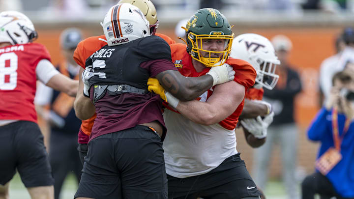 National team DL Aeneas Peebles of Virginia Tech battles National team OL Grey Zabel of North Dakota State.