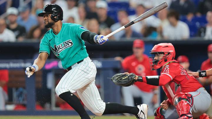 Aug 9, 2026; Miami, Florida, USA; Miami Marlins shortstop Otto Lopez (6) hits an RBI single against the Los Angeles Angels during the first inning at loanDepot Park. Mandatory Credit: Sam Navarro-Imagn Images
