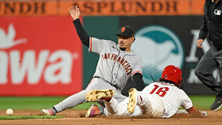 Apr 28, 2026; Philadelphia, Pennsylvania, USA; Philadelphia Phillies center fielder Brandon Marsh (16) steals second base ahead of tag by San Francisco Giants shortstop Willy Adames (2) during the eighth inning at Citizens Bank Park. Mandatory Credit: Eric Hartline-Imagn Images