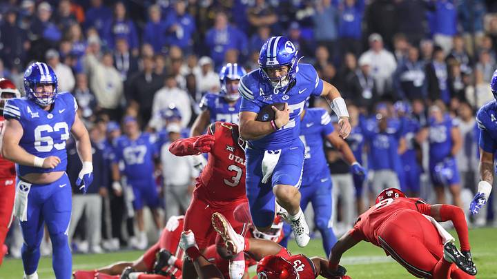 Oct 18, 2025; Provo, Utah, USA; BYU Cougars quarterback Bear Bachmeier (47) runs for a touchdown against Utah Utes defensive tackle Pupu Sepulona (45), cornerback Elijah Davis (9) and linebacker Levani Damuni (3) during the second half at LaVell Edwards Stadium. Mandatory Credit: Rob Gray-Imagn Images Oct 18, 2025; Provo, Utah, USA; BYU Cougars quarterback Bear Bachmeier (47) runs for a touchdown against Utah Utes defensive tackle Pupu Sepulona (45), cornerback Elijah Davis (9) and linebacker Levani Damuni (3) during the second half at LaVell Edwards Stadium. Mandatory Credit: Rob Gray-Imagn Images