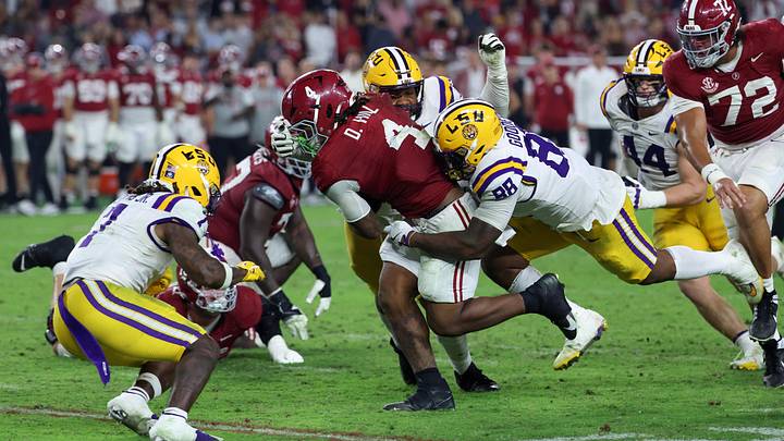 Louisiana State Tigers defensive lineman Bernard Gooden (88) tackles Alabama Crimson Tide running back Daniel Hill (4) during the fourth quarter of the game at Saban Field at Bryant-Denny Stadium.