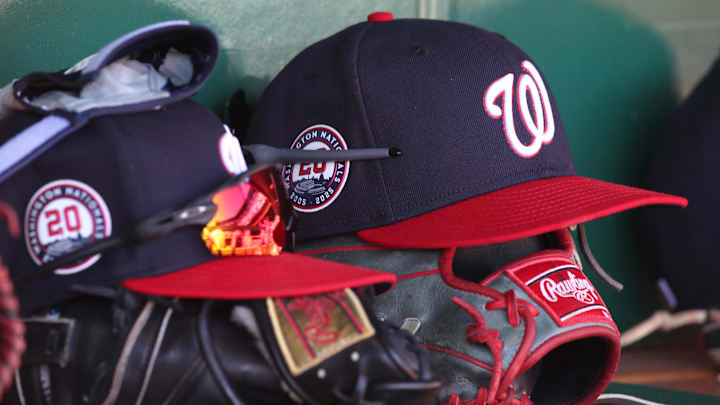 Apr 17, 2025; Pittsburgh, Pennsylvania, USA; Washington Nationals hats and gloves in the dugout against the Pittsburgh Pirates during the sixth inning at PNC Park. 