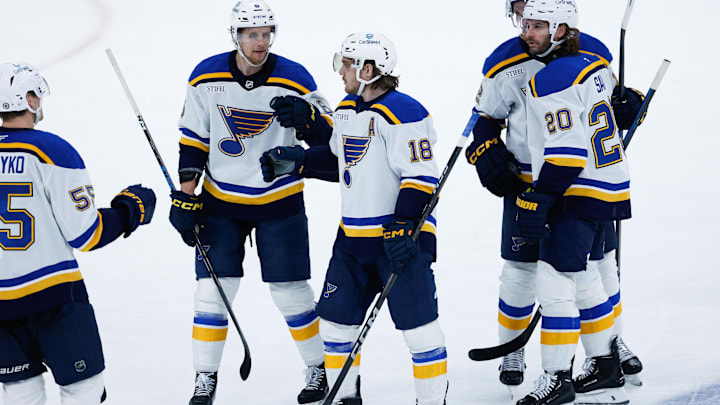 Dec 3, 2024; Winnipeg, Manitoba, CAN;  St. Louis Blues forward Robert Thomas (18) is congratulated by his teammates on his goal against the Winnipeg Jets during the third period at Canada Life Centre. Mandatory Credit: Terrence Lee-Imagn Images