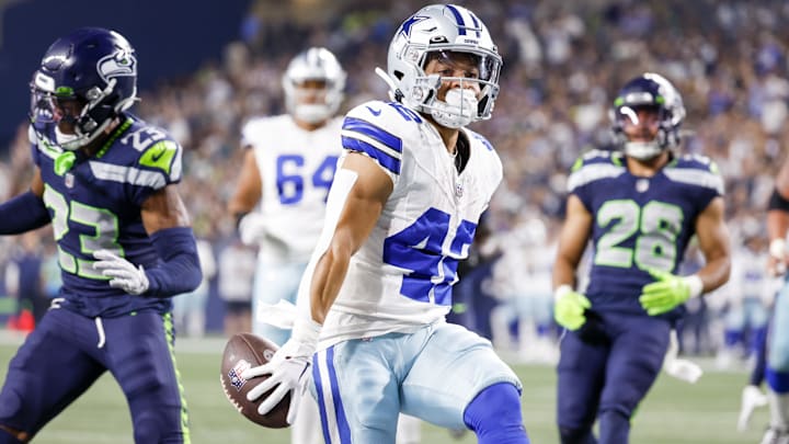 Aug 19, 2023; Seattle, Washington, USA; Dallas Cowboys running back Deuce Vaughn (42) escapes a