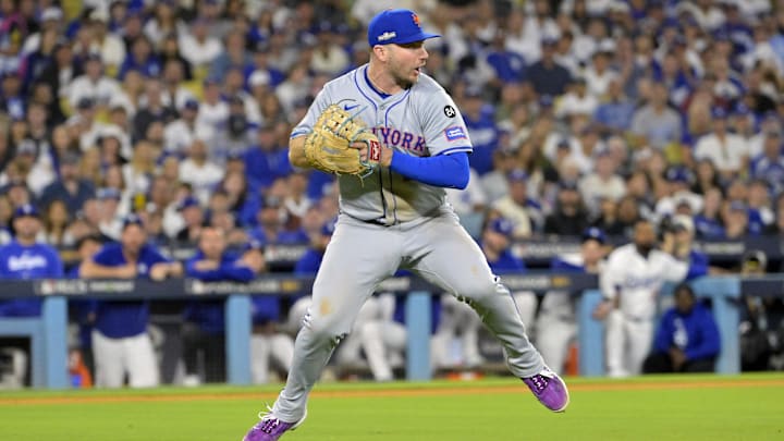 Oct 20, 2024; Los Angeles, California, USA; New York Mets first baseman Pete Alonso (20) fields the ball hit by Los Angeles Dodgers second baseman Chris Taylor (not pictured) in the sixth inning during game six of the NLCS for the 2024 MLB playoffs at Dodger Stadium. 