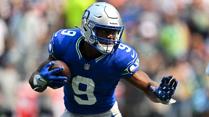Kenneth Walker in the royal blue throwback uniform
