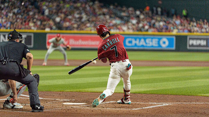 Sep 21, 2025; Phoenix, Arizona, USA; Arizona Diamondbacks outfielder Corbin Carroll (7) hits a home run in the second inning against the Philadelphia Phillies at Chase Field. Mandatory Credit: Allan Henry-Imagn Images Sep 21, 2025; Phoenix, Arizona, USA; Arizona Diamondbacks outfielder Corbin Carroll (7) hits a home run in the second inning against the Philadelphia Phillies at Chase Field. Mandatory Credit: Allan Henry-Imagn Images