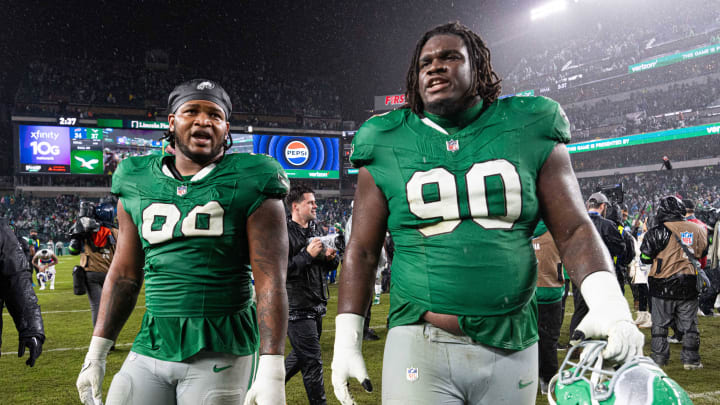 Nov 26, 2023; Philadelphia, Pennsylvania, USA; Philadelphia Eagles defensive tackle Jordan Davis (90) and defensive tackle Jalen Carter (98) walk off the field after a victory against the Buffalo Bills at Lincoln Financial Field. Bill Streicher-USA TODAY Sports