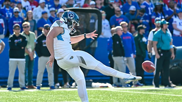 Oct 20, 2024; Orchard Park, New York, USA; Tennessee Titans punter Ryan Stonehouse (4) makes contact with the ball in the fourth quarter against the Buffalo Bills at Highmark Stadium. Mandatory Credit: Mark Konezny-Imagn Images