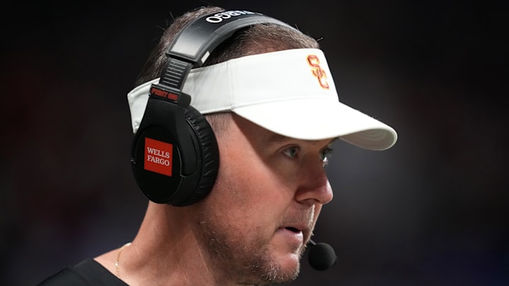 Dec 30, 2025; San Antonio, TX, USA; Southern California Trojans head coach Lincoln Riley watches in the first half against the TCU Horned Frogs during the Alamo Bowl at Alamodome. Mandatory Credit: Kirby Lee-Imagn Images