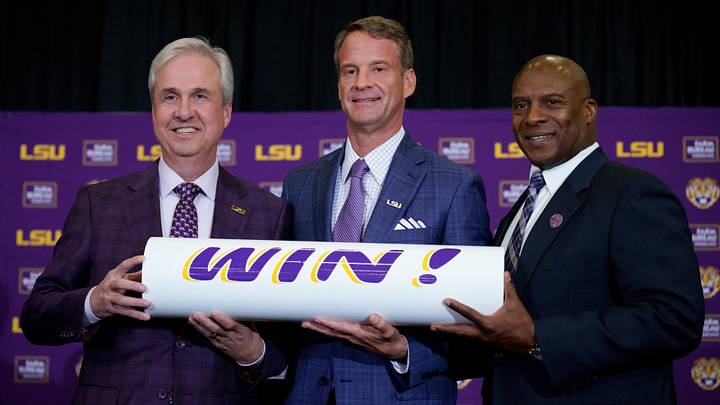 Dec 1, 2025; Baton Rouge, LA, USA; LSU president Wade Rousse, left, LSU new head coach Lane Kiffin and LSU athletic director Verge Ausberry stand together at South Stadium Club at Tiger Stadium. Mandatory Credit: Matthew Hinton-Imagn Images Dec 1, 2025; Baton Rouge, LA, USA; LSU president Wade Rousse, left, LSU new head coach Lane Kiffin and LSU athletic director Verge Ausberry stand together at South Stadium Club at Tiger Stadium. Mandatory Credit: Matthew Hinton-Imagn Images