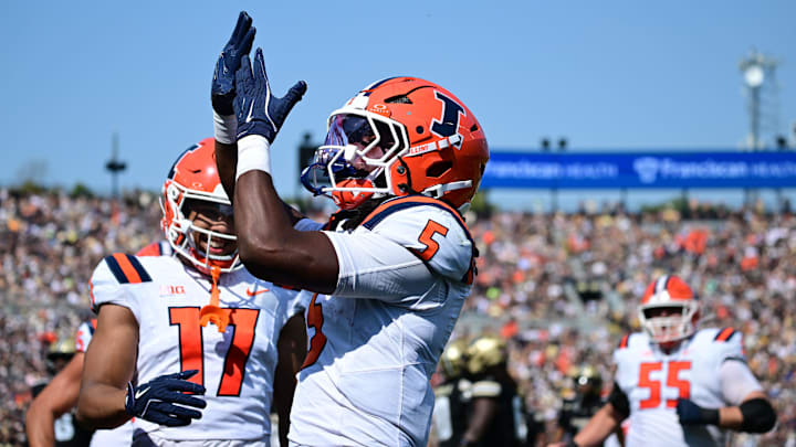 Oct 4, 2025; West Lafayette, Indiana, USA; Illinois Fighting Illini running back Ca'Lil Valentine (5) celebrates a touchdown during the second quarter against the Purdue Boilermakers at Ross-Ade Stadium. Mandatory Credit: Marc Lebryk-Imagn Images Oct 4, 2025; West Lafayette, Indiana, USA; Illinois Fighting Illini running back Ca'Lil Valentine (5) celebrates a touchdown during the second quarter against the Purdue Boilermakers at Ross-Ade Stadium. Mandatory Credit: Marc Lebryk-Imagn Images