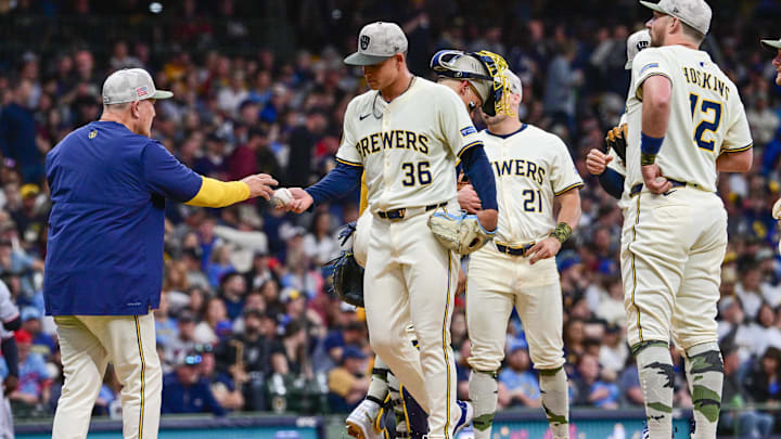 May 17, 2025; Milwaukee, Wisconsin, USA;  Milwaukee Brewers starting pitcher Tobias Myers (36) hands the ball to  manager Pat Murphy during a pitching change in the fourth inning against the Minnesota Twins at American Family Field. Mandatory Credit: Benny Sieu-Imagn Images