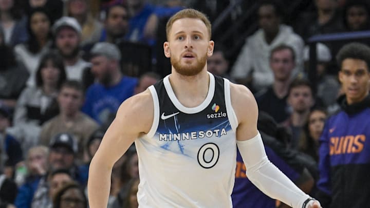 Nov 17, 2024; Minneapolis, Minnesota, USA; Minnesota Timberwolves guard Donte DiVincenzo (0) brings the ball up-court against the Phoenix Suns during the third quarter at Target Center. Mandatory Credit: Nick Wosika-Imagn Images