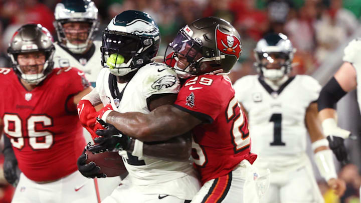 Sep 25, 2023; Tampa, Florida, USA; Philadelphia Eagles wide receiver A.J. Brown (11) runs with the ball as Tampa Bay Buccaneers safety Christian Izien (29) defends during the first half at Raymond James Stadium. Mandatory Credit: Kim Klement Neitzel-Imagn Images