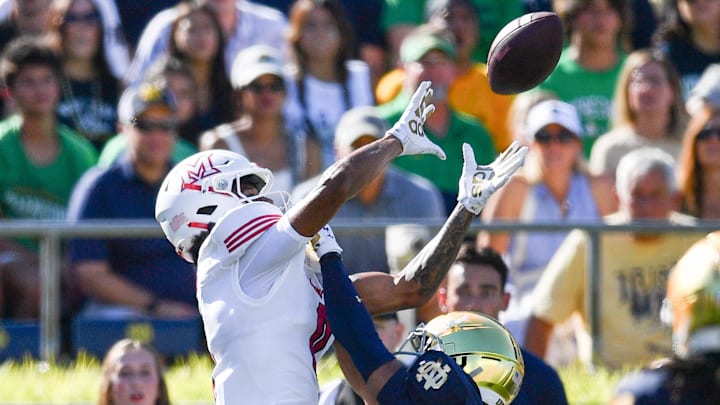 Notre Dame Fighting Irish cornerback Jaden Mickey (7) breaks up a pass intended for Miami Redhawks wide receiver Reggie Virgil (0) 