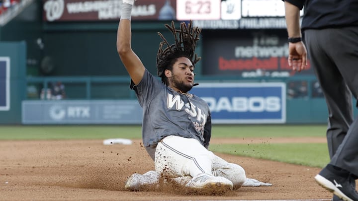 Sep 28, 2024; Washington, District of Columbia, USA; Washington Nationals outfielder James Wood (29) slides into third base after hitting a triple against the Philadelphia Phillies during the eighth inning at Nationals Park.