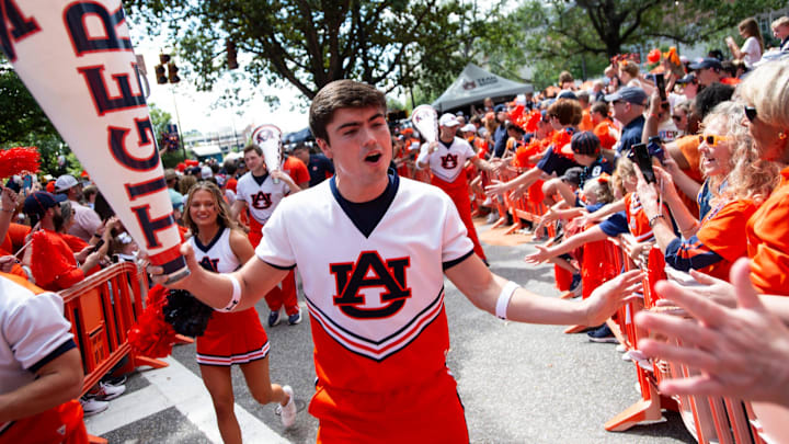 Prior to Saturday's game, an Auburn football cheerleader decked an Oklahoma player while doing a back flip. Prior to Saturday's game, an Auburn football cheerleader decked an Oklahoma player while doing a back flip.