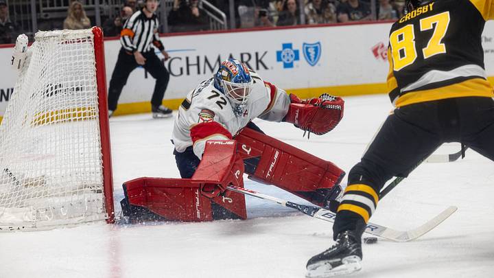 Apr 4, 2026; Pittsburgh, Pennsylvania, USA; Florida Panthers goalie Sergei Bobrovsky (72) pokes at the puck against Pittsburgh Penguins center Sidney Crosby (87) during the first period at PPG Paints Arena. Mandatory Credit: Mark Alberti-Imagn Images
