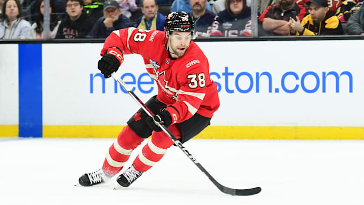 Feb 17, 2025; Boston, MA, USA; [Imagn Images direct customers only]  Team Canada forward Brandon Hagel (38) controls the puck during the first period in a 4 Nations Face-Off ice hockey game against Team Finland at TD Garden. Mandatory Credit: Bob DeChiara-Imagn Images