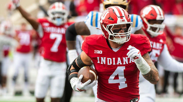 Indiana linebacker Aiden Fisher returns an interception for a touchdown against UCLA on Oct. 25, 2025, at Memorial Stadium.