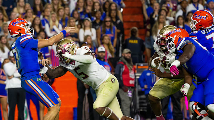 Florida State Seminoles defensive lineman Jared Verse (5) pressures Florida Gators quarterback Max Brown (17) at Steve Spurrier Field at Ben Hill Griffin Stadium in Gainesville, FL on Saturday, November 25, 2023 during the second half. Florida State won 24-15. [Doug Engle/Gainesville Sun]