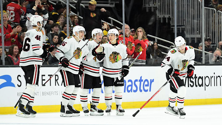 Apr 10, 2025; Boston, Massachusetts, USA; Chicago Blackhawks defenseman Kevin Korchinski (14) skates to the bench after scoring a goal during the third period against the Boston Bruins at TD Garden. Mandatory Credit: Bob DeChiara-Imagn Images