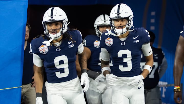 Penn State cornerback Elliot Washington II (9) hits the field with former teammate Jalen Kimber for the 2024 Fiesta Bowl against Boise State. 