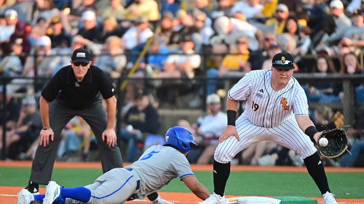 Southern Miss Golden Eagles first baseman Matthew Russo (19) attempts to pickoff UC Santa Barbara Gauchos shortstop Jonathan Mendez (5) during the game at Pete Taylor Park in Hattiesburg, Miss., on Friday, Feb. 13, 2026.
