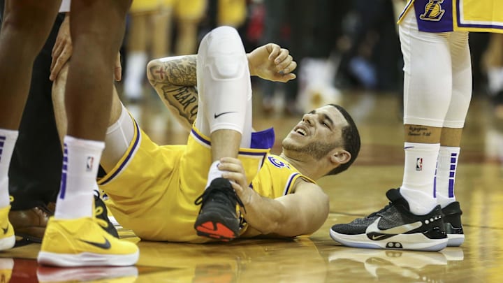 Jan 19, 2019; Houston, TX, USA; Los Angeles Lakers guard Lonzo Ball (2) holds his leg after a play during the third quarter against the Houston Rockets at Toyota Center. Mandatory Credit: Troy Taormina-Imagn Images