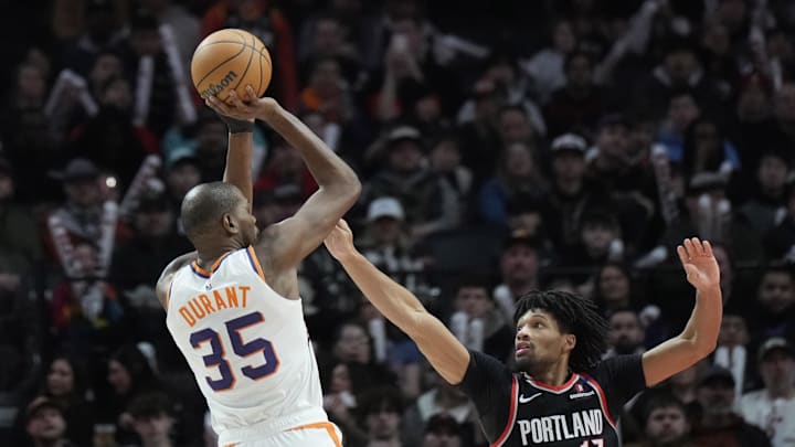 Feb 1, 2025; Portland, Oregon, USA; Phoenix Suns power forward Kevin Durant (35) shoots the ball over Portland Trail Blazers shooting guard Shaedon Sharpe (17) during the second half at Moda Center. Mandatory Credit: Soobum Im-Imagn Images