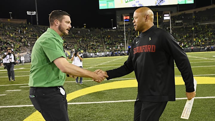 Oct 1, 2022; Eugene, Oregon, USA; Stanford Cardinal head coach David Shaw congratulates Oregon Ducks head coach Dan Lanning after a game at Autzen Stadium. The Ducks won the game 45-27. Mandatory Credit: Troy Wayrynen-Imagn Images