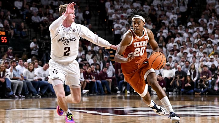 Jan 4, 2025; College Station, Texas, USA; Texas Longhorns guard Tre Johnson (20) drives to the basket as Texas A&M Aggies guard Hayden Hefner (2) defends during the second half at Reed Arena. The Aggies defeated the Longhorns 80-60. Mandatory Credit: Maria Lysaker-Imagn Images Jan 4, 2025; College Station, Texas, USA; Texas Longhorns guard Tre Johnson (20) drives to the basket as Texas A&M Aggies guard Hayden Hefner (2) defends during the second half at Reed Arena. The Aggies defeated the Longhorns 80-60. Mandatory Credit: Maria Lysaker-Imagn Images