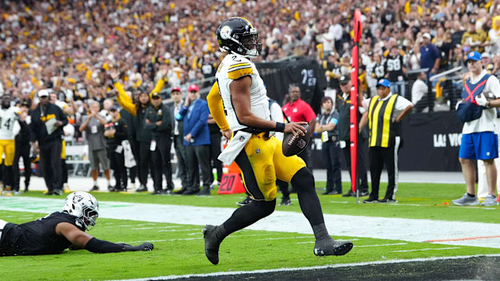 Oct 13, 2024; Paradise, Nevada, USA; Pittsburgh Steelers quarterback Justin Fields (2) scores a rushing touchdown against the Las Vegas Raiders during the second quarter at Allegiant Stadium. Mandatory Credit: Stephen R. Sylvanie-Imagn Images