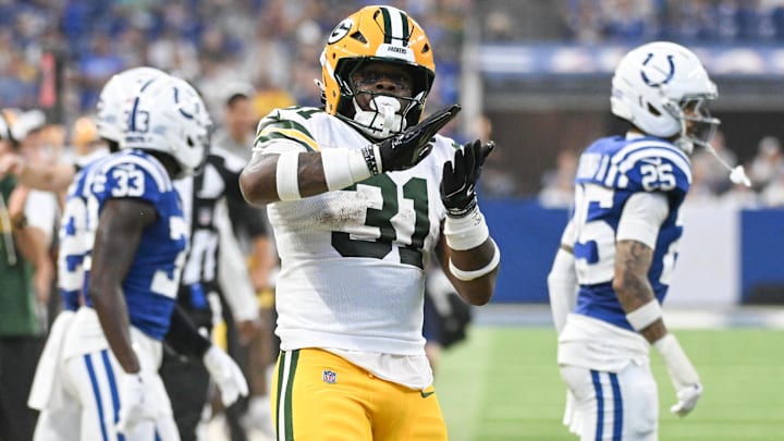 Aug 16, 2025; Indianapolis, Indiana, USA; Green Bay Packers running back Emanuel Wilson (31) celebrates after running for a first down during the first half against the Indianapolis Colts at Lucas Oil Stadium. Mandatory Credit: Robert Goddin-Imagn Images