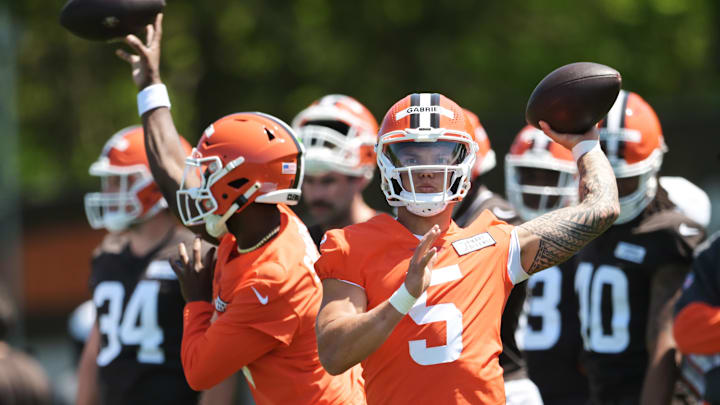 May 10, 2025; Berea, OH, USA; Cleveland Browns quarterback Dillon Gabriel (5) and quarterback Shedeur Sanders (12) throw passes during rookie minicamp at CrossCountry Mortgage Campus. Mandatory Credit: Ken Blaze-Imagn Images May 10, 2025; Berea, OH, USA; Cleveland Browns quarterback Dillon Gabriel (5) and quarterback Shedeur Sanders (12) throw passes during rookie minicamp at CrossCountry Mortgage Campus. Mandatory Credit: Ken Blaze-Imagn Images