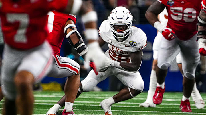 Texas Longhorns running back Quintrevion Wisner (26) runs the ball during the College Football Playoff semifinal game against Ohio State in the Cotton Bowl at AT&T Stadium on Friday, Jan. 10, 2024 in Arlington, Texas.