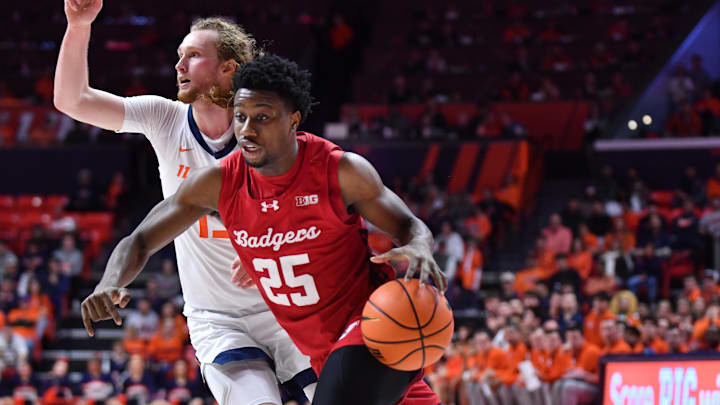 Feb 10, 2026; Champaign, Illinois, USA; Wisconsin Badgers guard John Blackwell (25) drives the ball past Illinois Fighting Illini forward Jake Davis (15) during the second half at State Farm Center. Mandatory Credit: Ron Johnson-Imagn Images Feb 10, 2026; Champaign, Illinois, USA; Wisconsin Badgers guard John Blackwell (25) drives the ball past Illinois Fighting Illini forward Jake Davis (15) during the second half at State Farm Center. Mandatory Credit: Ron Johnson-Imagn Images