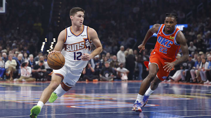 Nov 28, 2025; Oklahoma City, Oklahoma, USA; Phoenix Suns guard Collin Gillespie (12) drives to the basket around Oklahoma City Thunder guard Cason Wallace (22) during the first quarter at Paycom Center. Mandatory Credit: Alonzo Adams-Imagn Images Nov 28, 2025; Oklahoma City, Oklahoma, USA; Phoenix Suns guard Collin Gillespie (12) drives to the basket around Oklahoma City Thunder guard Cason Wallace (22) during the first quarter at Paycom Center. Mandatory Credit: Alonzo Adams-Imagn Images