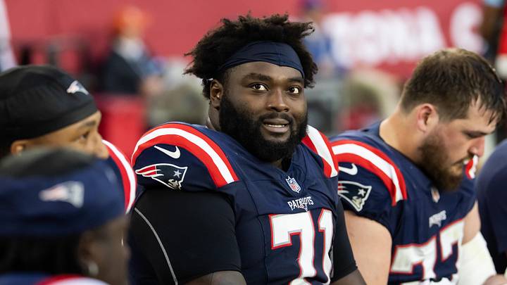 Dec 15, 2024; Glendale, Arizona, USA; New England Patriots offensive tackle Mike Onwenu (71) against the Arizona Cardinals at State Farm Stadium. Mandatory Credit: Mark J. Rebilas-Imagn Images Dec 15, 2024; Glendale, Arizona, USA; New England Patriots offensive tackle Mike Onwenu (71) against the Arizona Cardinals at State Farm Stadium. Mandatory Credit: Mark J. Rebilas-Imagn Images