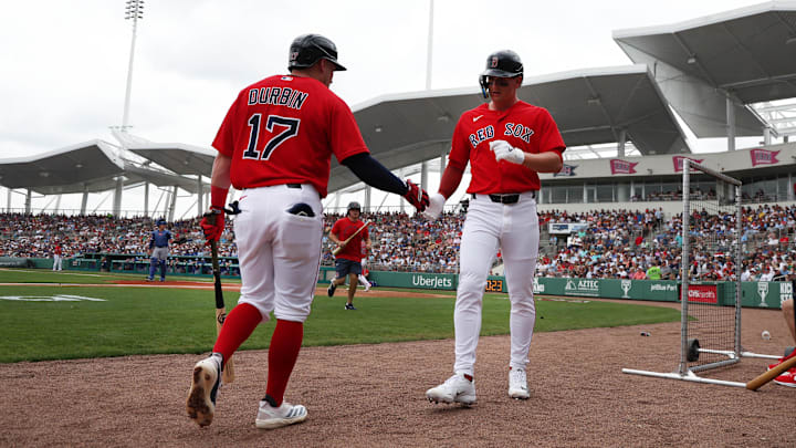 Feb 22, 2026; Fort Myers, Florida, USA;  Boston Red Sox designated hitter Roman Anthony (19) is congratulated by infielder Caleb Durbin (17) after he scored during the first inning at JetBlue Park at Fenway South. Mandatory Credit: Kim Klement Neitzel-Imagn Images