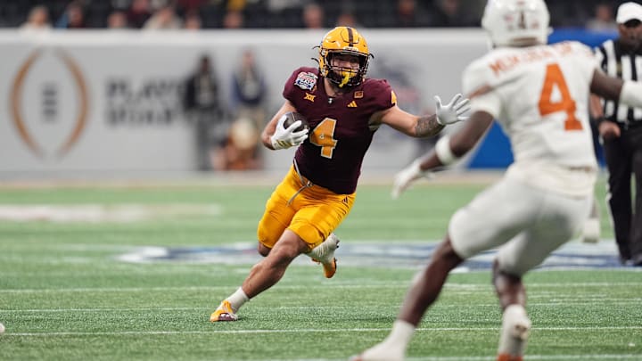 Jan 1, 2025; Atlanta, GA, USA; Arizona State Sun Devils running back Cam Skattebo (4) runs with the ball against the Texas Longhorns during the second half of the Peach Bowl at Mercedes-Benz Stadium. Mandatory Credit: Dale Zanine-Imagn Images