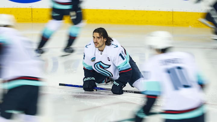 Feb 8, 2025; Calgary, Alberta, CAN; Seattle Kraken left wing Brandon Tanev (13) during the warmup period against the Calgary Flames at Scotiabank Saddledome. Mandatory Credit: Sergei Belski-Imagn Images
