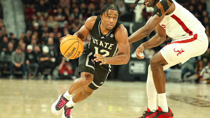 Jan 29, 2025; Starkville, Mississippi, USA; Mississippi State Bulldogs guard Josh Hubbard (12) drives to the basket against the Alabama Crimson Tide during the second half at Humphrey Coliseum. Mandatory Credit: Wesley Hale-Imagn Images
